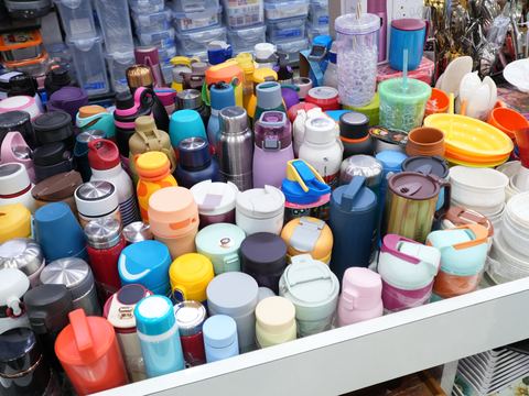 Rows of coloured flasks, bottles and storage containers.